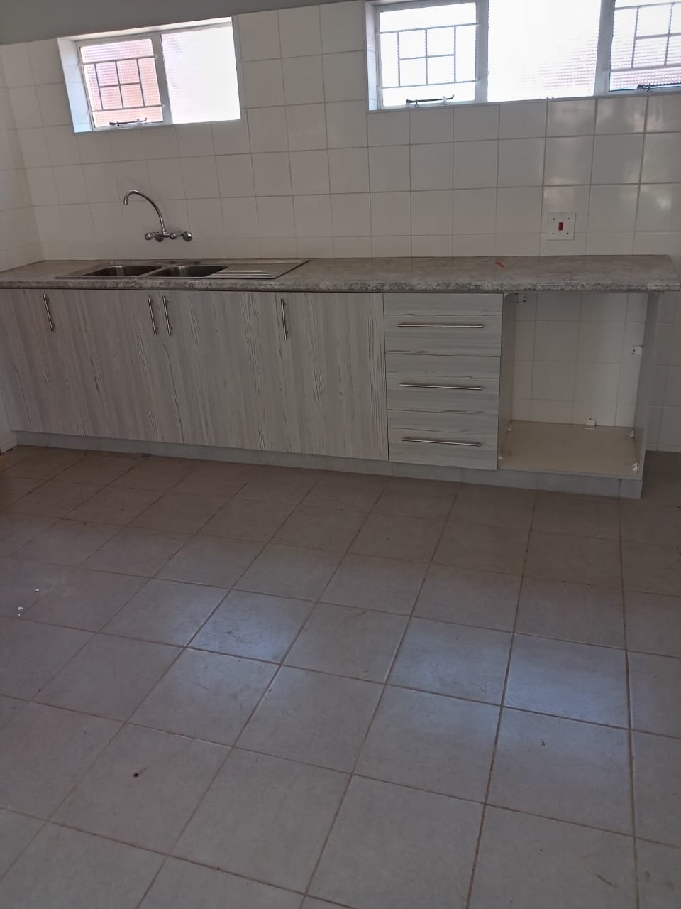 Carpenter refitting doors and skirting boards